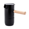 Detail shot of the sustainable rubberwood handle on the Stelton Collar moka pot.