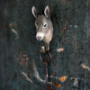 WILDLIFE GARDEN Wall hook Donkey mounted on a black wall.