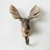 Front view of a hand-carved wooden Moose wall hook, featuring its large palmate antlers, long snout, and realistic hand-painted brown fur.