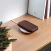 LEXON PowerSound Wireless Qi Power Bank & Speaker Dark Brown on Qi charger on desk | the design gift shop