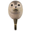 Front view of a hand-carved wooden Seal wall hook, featuring its rounded head, dark inquisitive eyes, and realistic hand-painted grey coat.