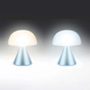 Two Lexon Mina Mini lights displayed together, one glowing with warm white light and the other with cool white light, demonstrating the dual-colour temperature feature.