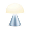 Close-up of the Lexon Mina Mini lamp, showcasing the sleek matte metallic finish of the light blue base and the minimalist buttonless design.
