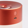 Detail view of top part of the orange Lexon Horizon Aromatherapy Diffuser.
