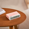 Pantone Rose Quartz alarm clock on table