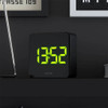 Black NEWGATE Alarm Clock "Space Hotel Orbatron" with green LED on shelf