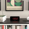 Black NEWGATE LCD Alarm Clock "Space Hotel Hypertron" with red LED on shelf