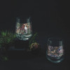 Ritzenhoff Shadow Fauna Gin Tumbler set with Pelican and Butterfly on black surface.