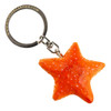 Starfish keyring hand-carved from lime wood, painted vivid orange with white spots, on a metal key ring.