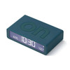 Angled view of the Deep Blue Lexon Flip Classic alarm clock with the 'ON' text embossed on the top surface.