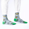 Person wearing SEXY SOCKS Tequila Made Me Do It bamboo socks styled with white rolled-up trousers.