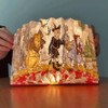Modgy Wonderful Wizard of Oz Light Book open glowing accordion lamp showcasing yellow brick road artwork.