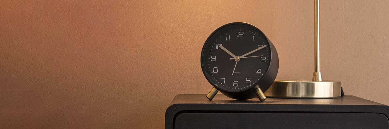 Karlsson Lofty alarm clock black on a bedside table