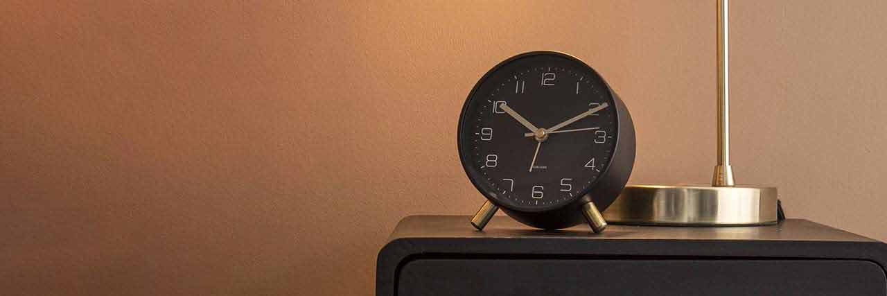 Black Karlsson alarm clock Lofty on a nightstand