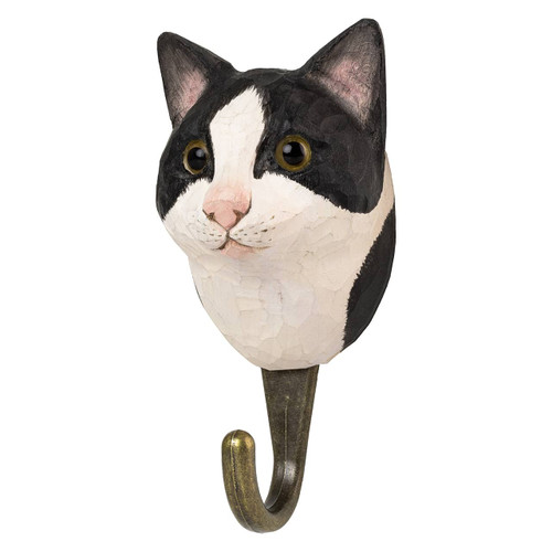 Three-quarter view of a hand-painted Black and White Cat wooden hook, highlighting the contrast between the dark and light carved fur details.