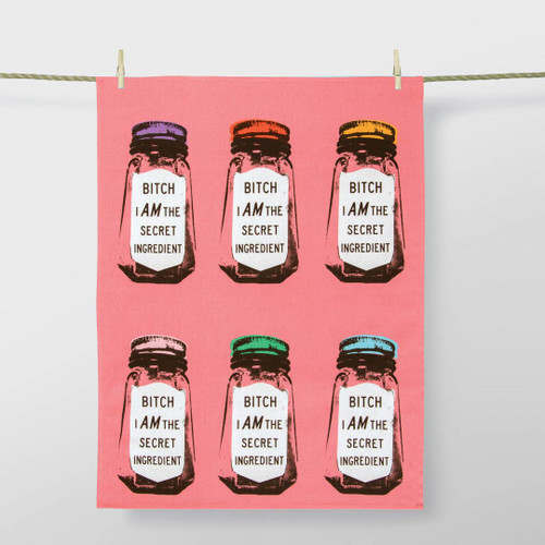 Dish Towel  'Bitch I am the secret ingredient' by Blue Q on a laundry line.
