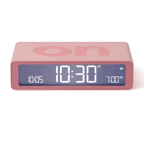 Lexon Flip Classic Alarm Clock in Pink showing 'ON' display with time 10:30, date, and alarm set for 7:00 AM.