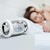 CLOCKY Chrome Alarm Clock On Wheels  beside bed CLOCKY Chrome Alarm Clock On Wheels  beside bed