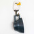 Three-quarter view of a wall-mounted hand-painted Bald Eagle wooden hook, carrying a cup.