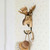 Side profile of a wall-mounted timber Moose decorative hook, holding a dish cleaning brush.