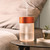 Orange Lexon Horizon Aromatherapy Diffuser on side table.
