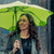 Lightweight green umbrella with rounded tips and sleeve

