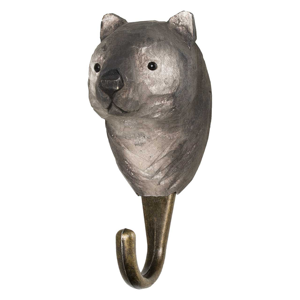 Three-quarter view of a hand-painted Wombat wooden hook, highlighting the intelligent eye detail and artisanal wood grain finish.