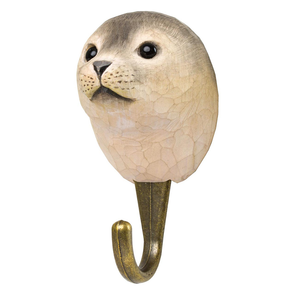 Three-quarter view of a hand-painted Seal wooden hook, highlighting the artisanal wood-carved texture and lifelike facial details.