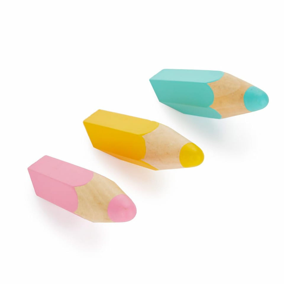 Set of three Balvi wooden wall hooks shaped like giant coloured pencils in pink, yellow, and turquoise.