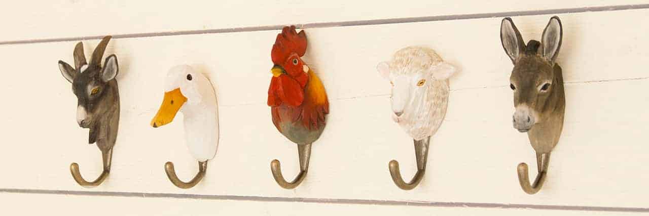 Five hand carved animal hooks