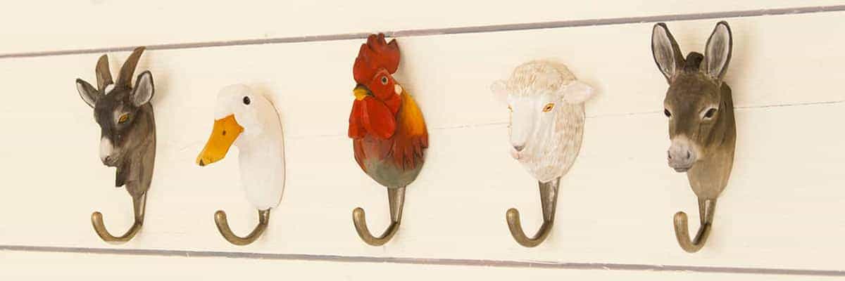 Five hand-carved animal hooks.