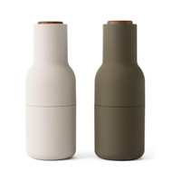Audo Norm salt & pepper bottle grinder set, one in hunting green, the other in beige, both with walnut lid | the design gift shop