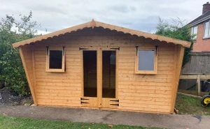 14x8 apex 2ft roof overhang & tapped sides x2 single windows & double long window doors 