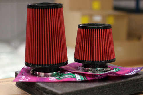 Two red Exoracing cone air filters of different heights