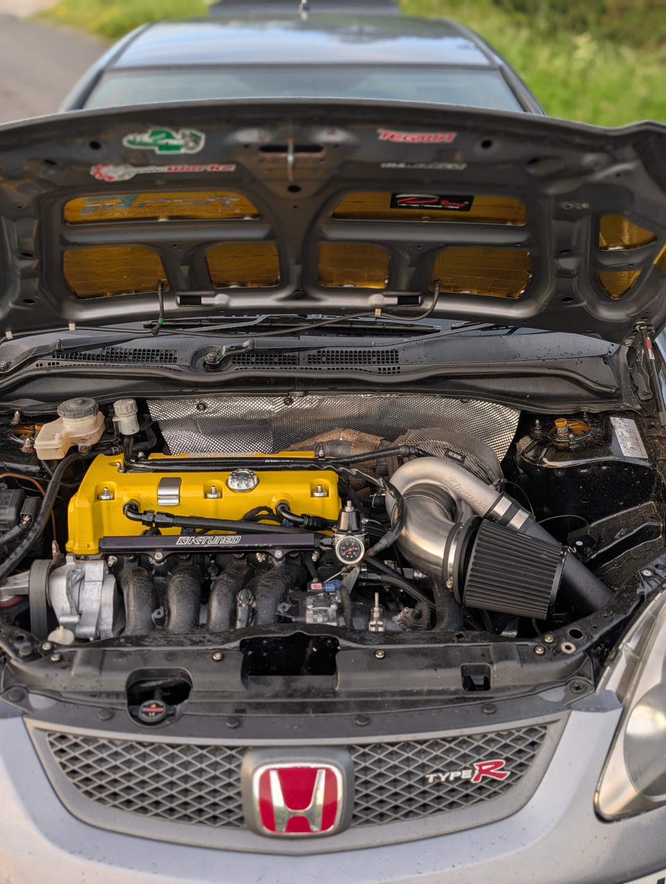 Full K20 turbo EP3 engine bay showing the turbo beside the rear bulkhead and heat shielding