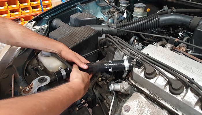 Fitting jubilee clips to both ends of a silicone coolant hose