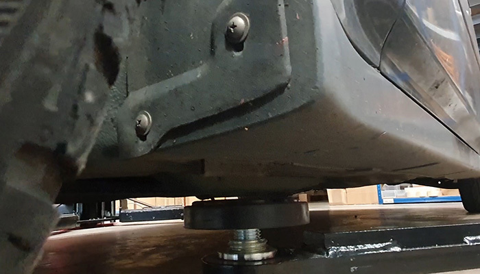 Ramp pad positioned on the correct jacking point before coolant hose work