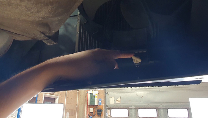 Locating the radiator drain bung before draining coolant