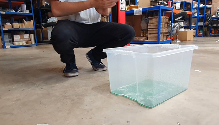 Coolant draining into a bucket during silicone hose installation