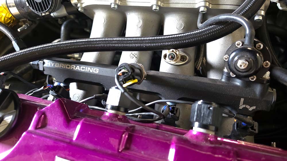 Fuel rail and line area on a turbo Honda Civic engine bay
