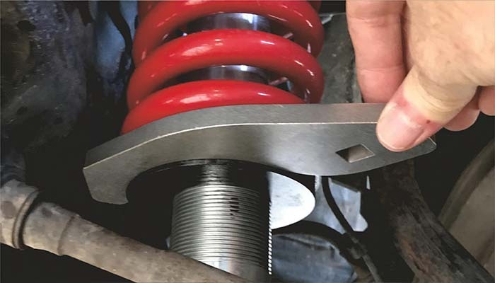 Coilover adjustment options for ride height spring rate damping and top mounts