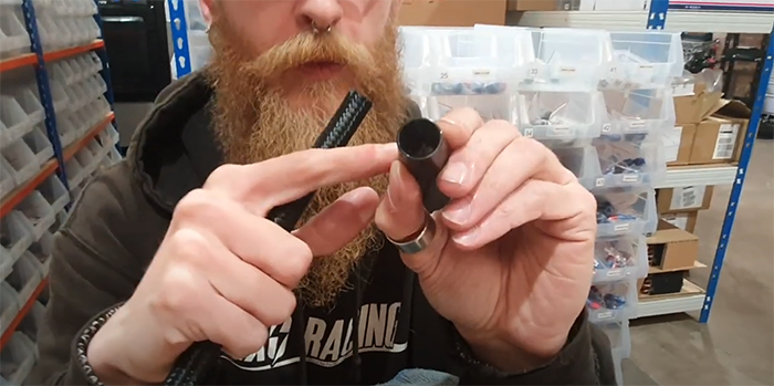 Internal lip inside an AN fitting socket where the rubber braided hose must seat
