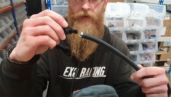 Pushing the AN PTFE fitting body into the liner and olive