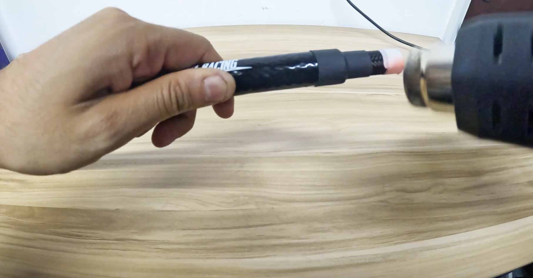 Heat shrink being used to seal silicone heat sleeve during installation