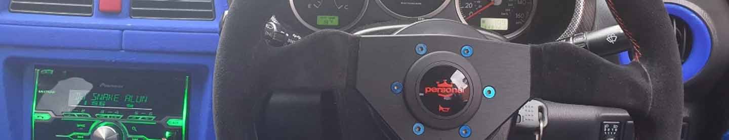 burnt titanium steering wheel image