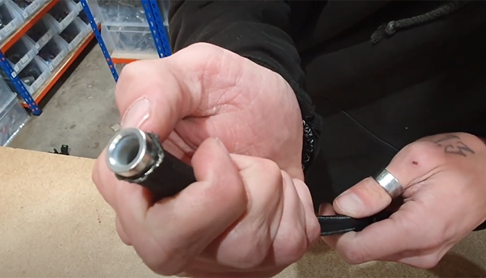 PTFE fitting olive seated correctly between the liner and braid