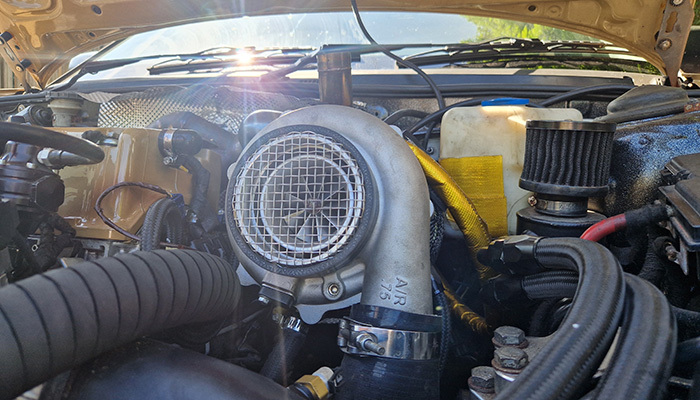 Turbo Honda engine bay showing why breather hose routing and heat clearance matter