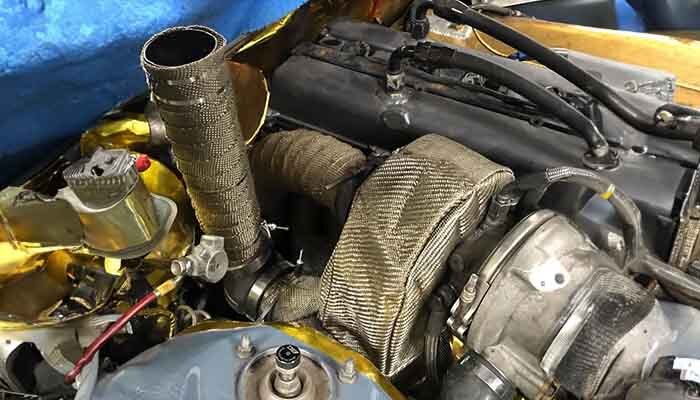 Close-up of Martin Wonnacott's drift car showing turbo heat management near the screamer pipe