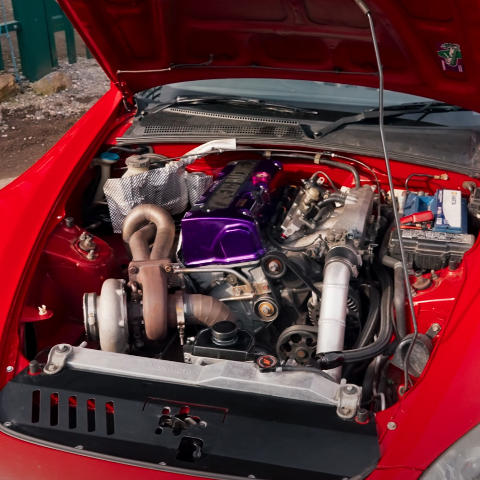 Embossed aluminium heat shield fitted between exhaust heat and vulnerable engine bay parts