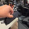 We do recommend removing the A-arms to do the drilling but you can position and mark the holes while they are on the truck.